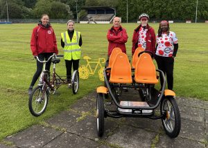 Olivia Dodds Communications Coordinator, Esh Group and Megan Roberts, Social Value Manager at Esh Construction, hand over the bikes to Streetbike charity