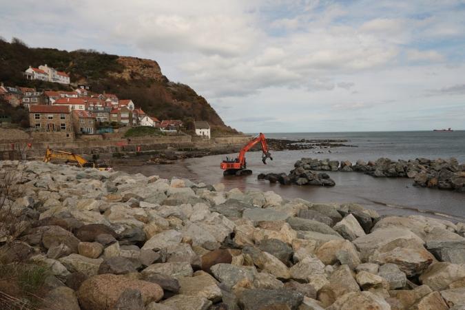 Runswick Bay Coastal Protection - image shows digger moving boulders to form the coastal defences