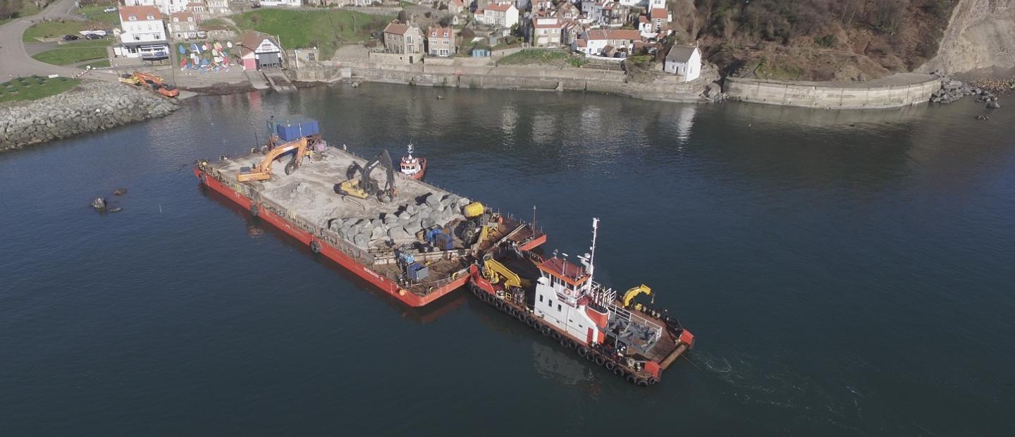 Runswick Bay Coastal Protection Runswick Bay Coastal Protection - image shows barge carrying boulders to form the coastal defences