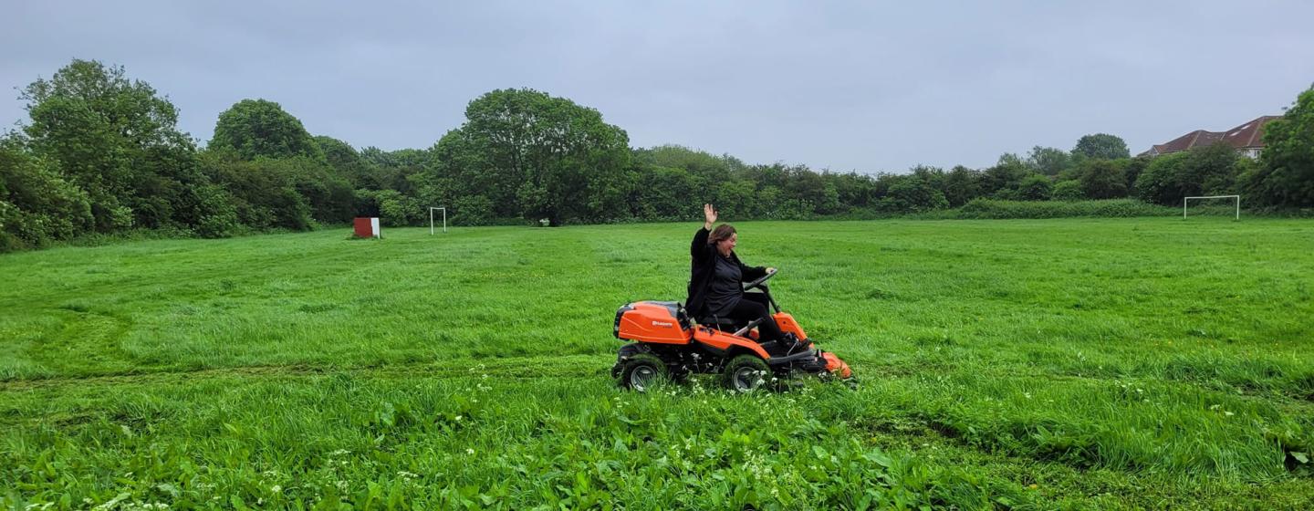 Ruben's Voice volunteer using a ride-on lawnmower Ruben's Voice volunteer using a ride-on lawnmower