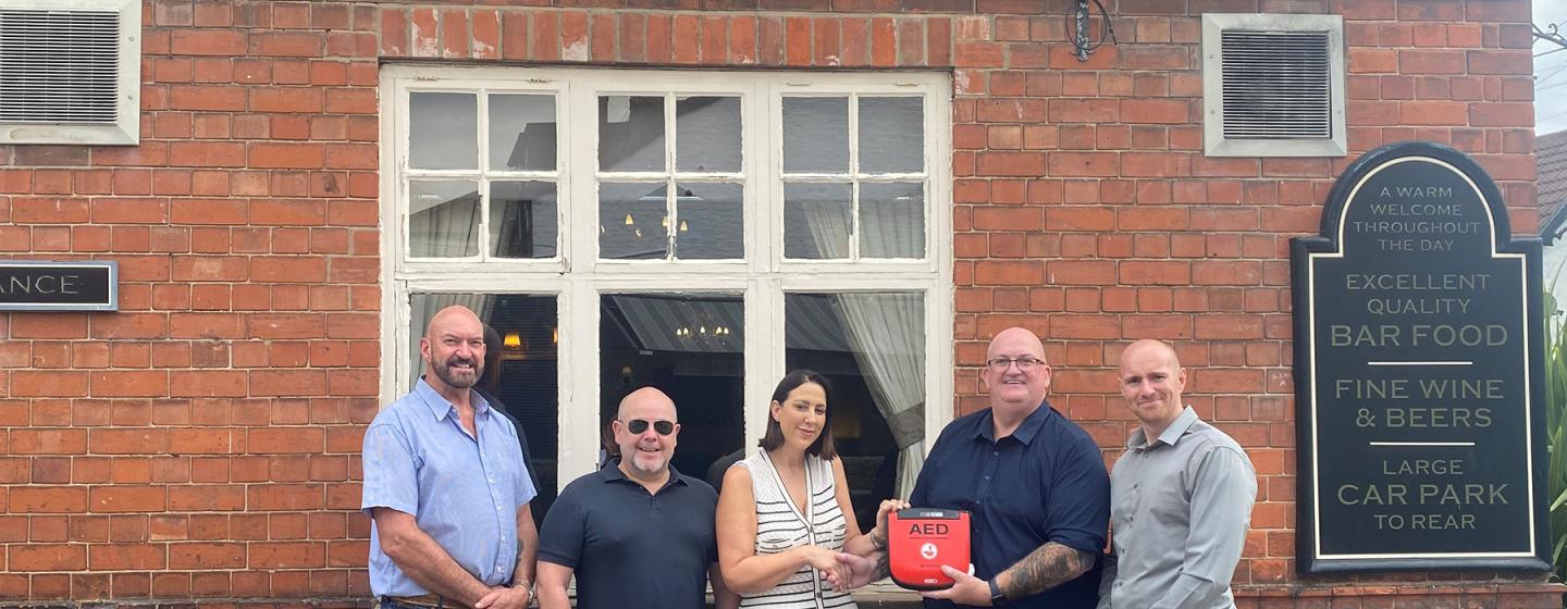 L-R Cllr Gary McMaster, Willerby and Kirk Ella Ward, Richard McKinnon, Hayley Waller, Landlady of The Star Inn, James Stevenson, Senior Project Manager, (GRAHAM) and Dan Cawthra, Head of Stakeholder & Community Engagement, (GRAHAM) with the defibrillator to be located at the pub in Willerby L-R Cllr Gary McMaster, Willerby and Kirk Ella Ward, Richard McKinnon, Hayley Waller, Landlady of The Star Inn, James Stevenson, Senior Project Manager, (GRAHAM) and Dan Cawthra, Head of Stakeholder & Community Engagement, (GRAHAM) with the defibrillator to be located at the pub in Willerby