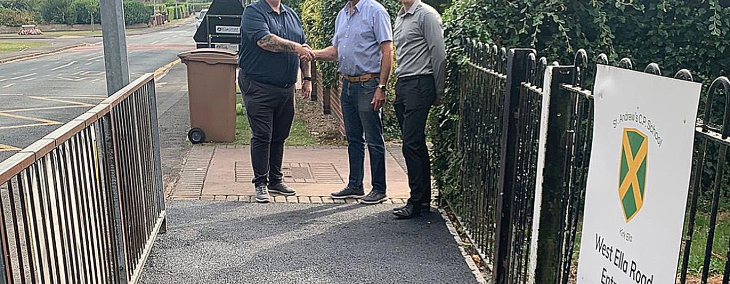 L_R James Stevenson, Senior Project Manager at GRAHAM shakes hands with Cllr Gary McMaster, on the new path at St Andrews Primary School, Kirk Ella with Dan Cawthra, Head of Stakeholder & Community Engagement at GRAHAM looking on. L_R James Stevenson, Senior Project Manager at GRAHAM shakes hands with Cllr Gary McMaster, on the new path at St Andrews Primary School, Kirk Ella with Dan Cawthra, Head of Stakeholder & Community Engagement at GRAHAM looking on.