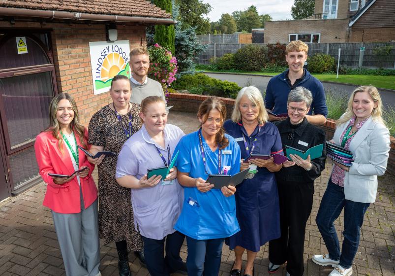Lindsey Lodge and Esh staff with the new tablets for patient use
