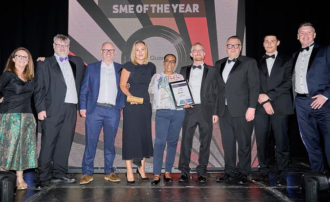 The Quantik team receive the SME of the Year award from Mike Raven