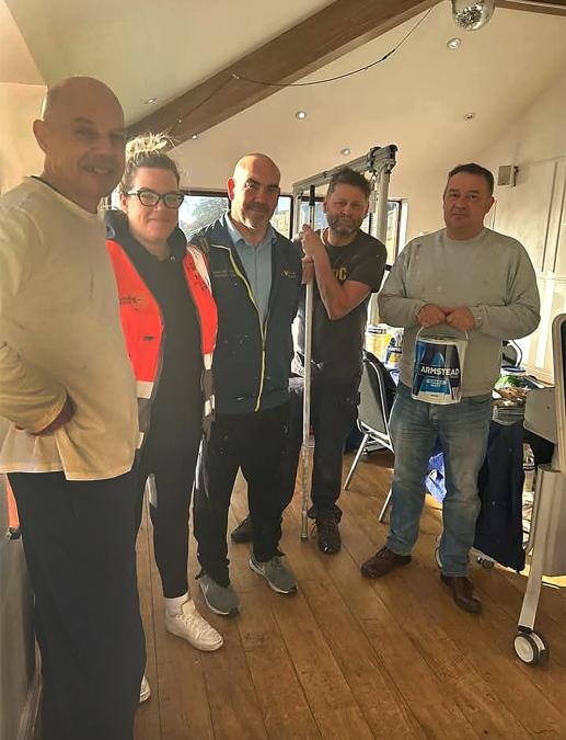 Wilmott Dixon's Mike Etherson, Vickie Thornton, Marcus Westmorland and Julian Sharpe and Paul Blackburn from Azko Nobel at Dewsbury Outreach building