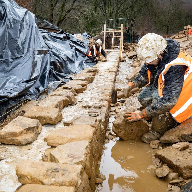 Esh staff rebuilding the retaining wall at Abbeydale Dam